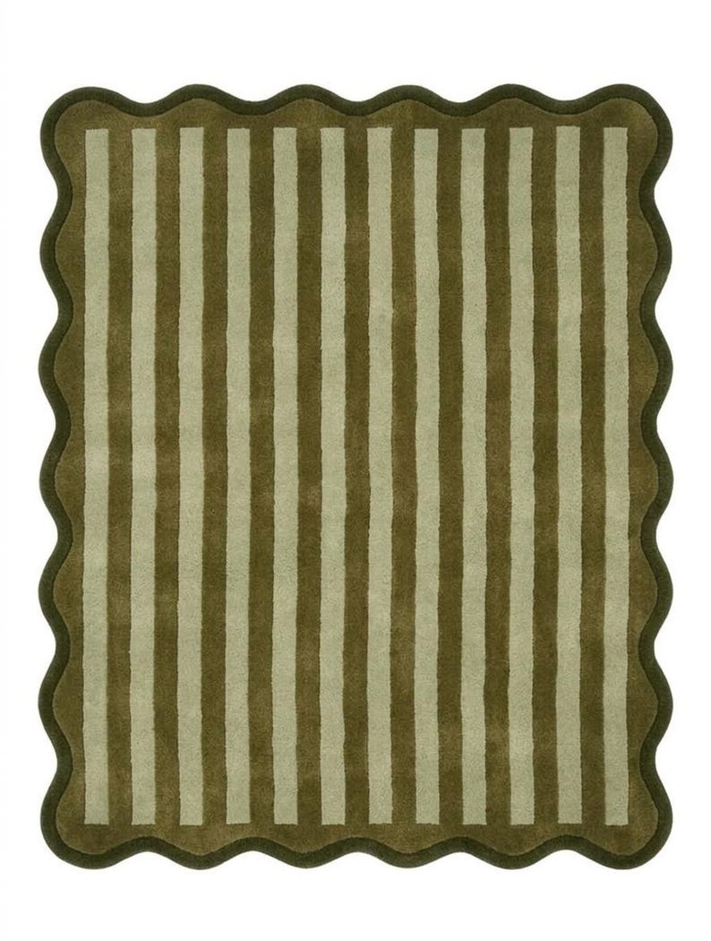 May include: A rectangular area rug featuring a repeating pattern of vertical olive green and light beige stripes. The rug is finished with a dark olive green scalloped edge that follows the wavy contour of the entire perimeter of the piece.
