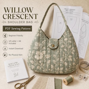 Puede incluir: Un bolso de hombro acolchado en color verde salvia con estampado floral y una sola asa, mostrado junto a un patrón de costura en PDF titulado Willow Crescent Shoulder Bag, tijeras de metal, muestras de tela, hilo y pinzas de costura.