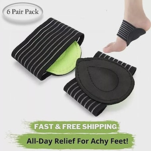 May include: A 6 pair pack of black arch support bands featuring white horizontal stripes and a lime green interior pad. The bands are designed to wrap around the midfoot, with one band shown worn on a foot and another displayed flat.