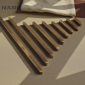 May include: A set of three ceramic mugs with a speckled, matte finish. The mugs are in shades of cream, light gray, and dark gray. Each mug has a simple, minimalist design, perfect for coffee or tea.