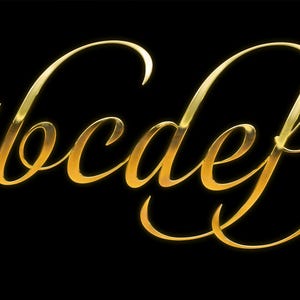 May include: Gold cursive letters a through g on a black background. The letters have a shiny, metallic appearance, with highlights and shadows that give them a three-dimensional look. The font is elegant and flowing.