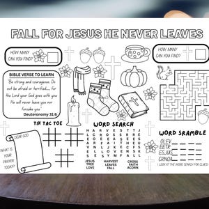 May include: Black and white activity sheet with the text "FALL FOR JESUS HE NEVER LEAVES." Includes a Bible verse, word search, tic-tac-toe, and other activities. Features images of a pumpkin, socks, and a squirrel.