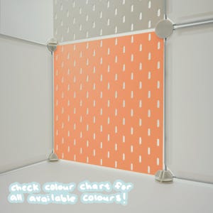 May include: A modular storage cube system featuring a bright orange pegboard panel with vertical slots, connected by white plastic corner joints. The text "check colour chart for all available colours!" is printed in white at the bottom.