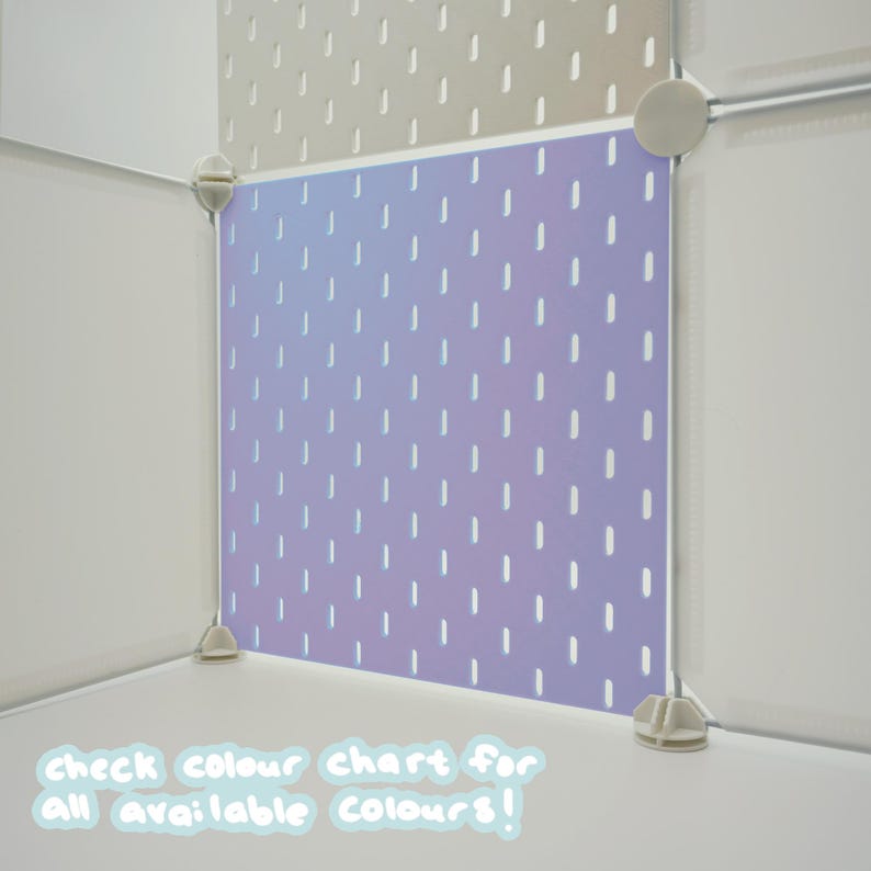 May include: A modular storage cube panel featuring a light purple surface with a repeating pattern of vertical white dashes. The panel is secured by light gray plastic corner connectors and is positioned next to a beige panel with similar slots.