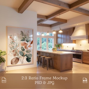 May include: A framed botanical print with a gold frame hangs on a white wall in a kitchen. The artwork features watercolor-style illustrations of leaves and flowers in shades of green, brown, and peach. The text at the bottom reads "2:3 Ratio Frame Mockup PSD & JPG."