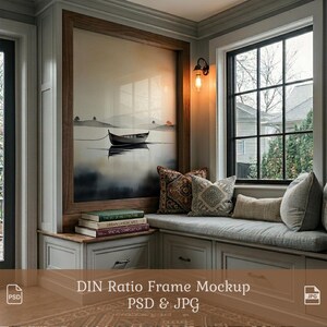 May include: A framed landscape art print featuring a boat on a lake, with a neutral color palette. The artwork is displayed above a built-in window seat with decorative pillows. The image includes the text "DIN Ratio Frame Mockup PSD & JPG".
