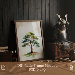 May include: A framed watercolor print of a tree with green and blue foliage and a brown trunk. The frame is brown. The print is displayed on a wooden surface with a Japanese samurai armor and a wooden chest.