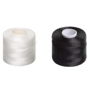 May include: Two cylindrical spools of thread are positioned side by side. One spool is white with a translucent appearance, while the other spool is solid black. Both spools feature a white circular core in the center for the thread to wind around.