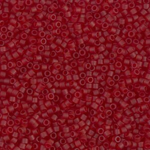 May include: A close-up shot of numerous small, cylindrical, translucent red beads. The beads are densely packed together, creating a textured surface. These beads are commonly used for jewelry making and crafting.