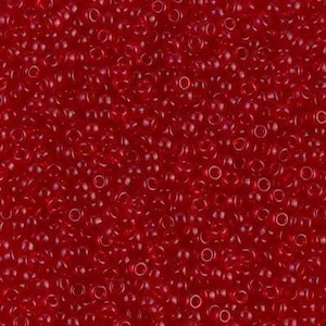 May include: A dense collection of small, round, translucent red glass seed beads. Each bead features a smooth, glossy surface and a central hole, creating a uniform, vibrant red texture across the entire frame of the image.