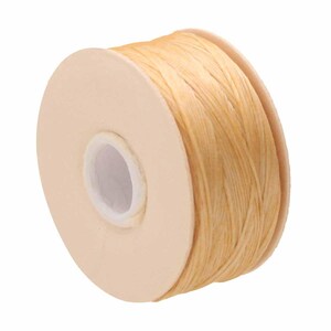 May include: A spool of light beige, textured cord wrapped around a circular cardboard core. The cord has a fibrous, natural appearance with a slightly twisted structure, wound tightly in multiple layers around the central spool.