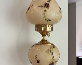 Glass lamp with floral decorations