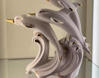 Glossy ceramic dolphins with gold decoration