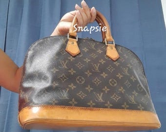 Authentic Louis vuitton Alma PM bag.