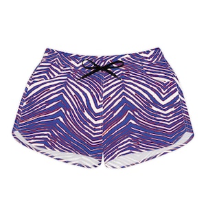 May include: Blue, white, and red patterned shorts with a black drawstring. The shorts feature a vibrant zebra-like design, perfect for casual wear or swimwear. The shorts are made of a lightweight material.