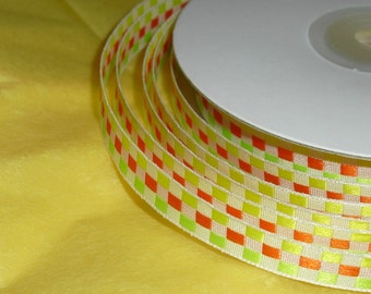 Spool of Ribbon with this great Geometric Design is mostly yellow / the ribbon is 3/8" X 25 yards