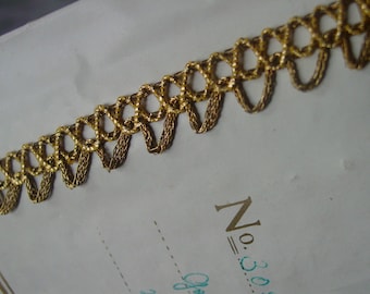 Gorgeous old ANTIQUE metallic gold braid trim with metallic gold woven swag, half yard