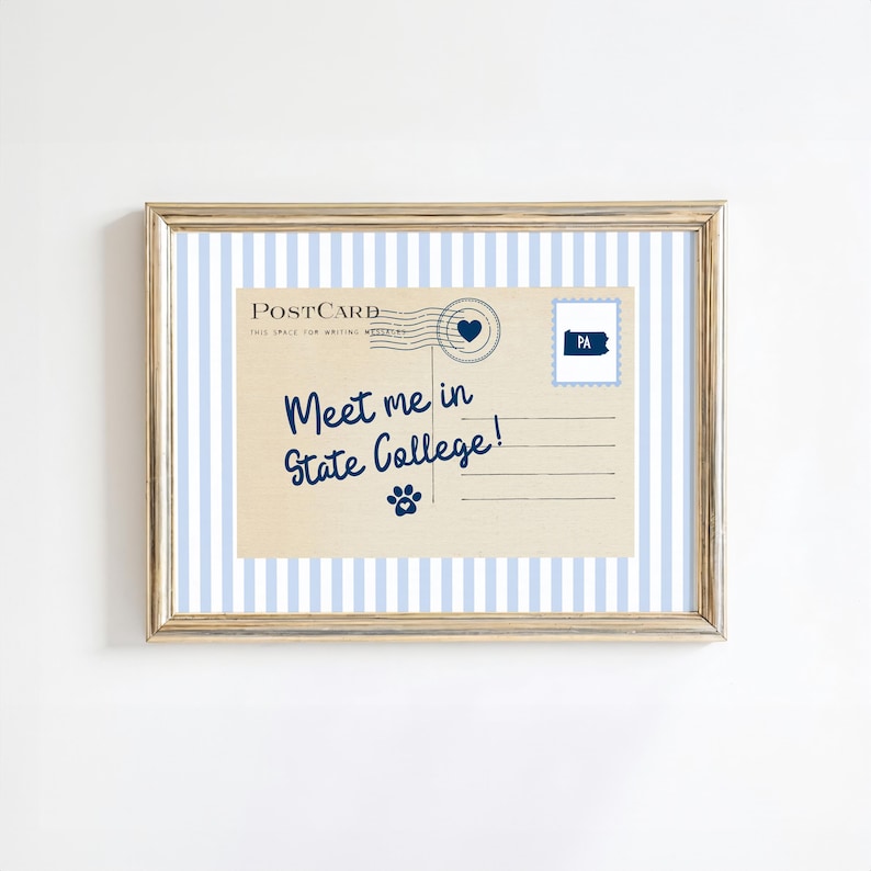 May include: A framed postcard print with a light blue and white striped background. The postcard features the text "Meet me in State College!" in navy blue script, along with a paw print and a postage stamp with "PA" on it.