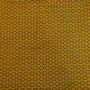 May include: Close-up of a fabric with a repeating pattern. The design features a series of interconnected, six-sided shapes in a dark brown color. Each shape contains a central cluster of small, light pink dots surrounded by a spiky, star-like outline.