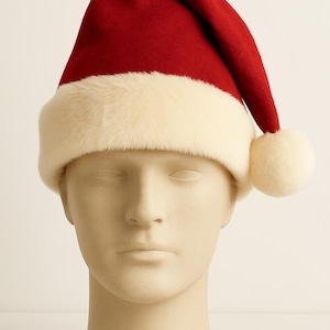 May include: A red Santa hat with a white faux fur trim and a white pom-pom. The hat is displayed on a mannequin head. The hat is a festive accessory for the holiday season.