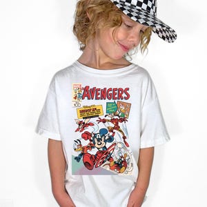 May include: A set of three ceramic canisters with lids, featuring a geometric pattern in shades of blue, white, and gray. The canisters vary in size, suitable for kitchen storage. The largest canister measures approximately 8 inches in height.