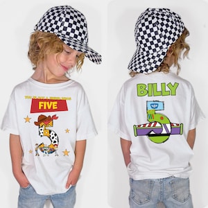 May include: A white t-shirt with a large number 5 design, cowboy hat, and the text "YOU'VE GOT A FRIEND IN ME". The back of the shirt has the name "BILLY" and a Buzz Lightyear-themed design. The child is wearing a black and white checkered baseball cap.