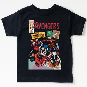 May include: Navy blue t-shirt featuring a comic book-style graphic of Disney characters as Avengers. The design includes Mickey Mouse as Captain America, Iron Man, and other characters. Text includes "The Avengers" and "What If..."