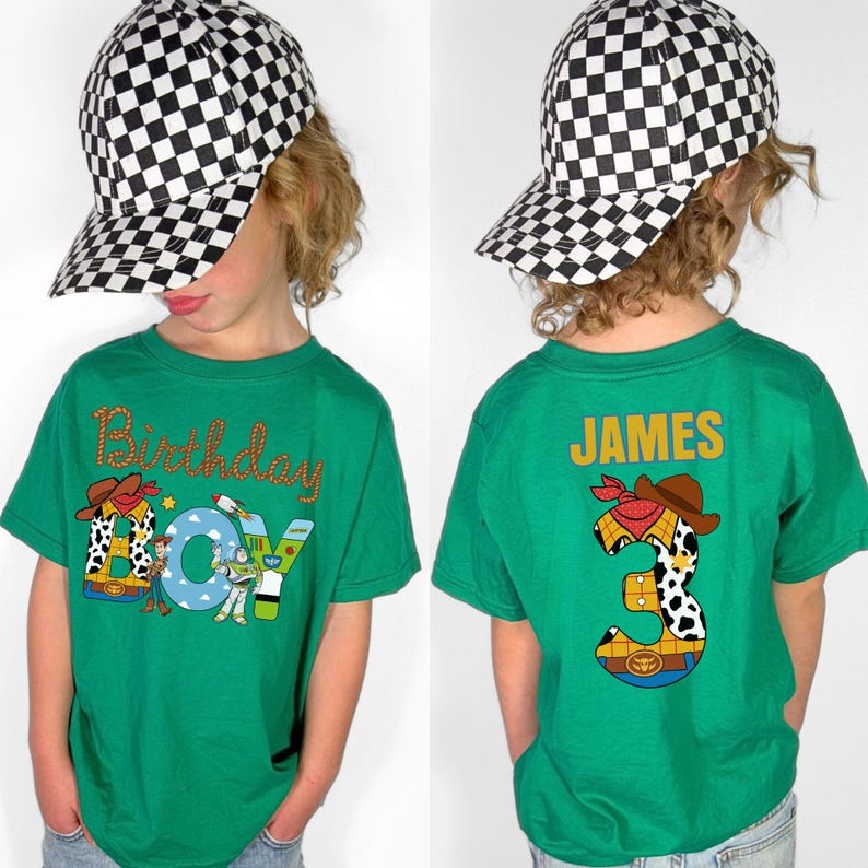 May include: A green t-shirt with the words "Birthday Boy" and a cartoon cowboy design. The back of the shirt has the name "JAMES" and a number "3" with a cowboy design. The child is wearing a black and white checkered baseball cap.