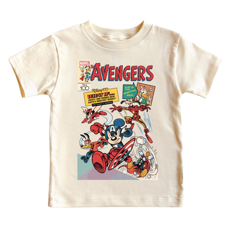May include: Cream-colored t-shirt featuring a comic book-style graphic of Disney characters as Avengers. The design includes Mickey Mouse as Captain America, Donald Duck, and Iron Man, with text reading "The Avengers" and "What If..."