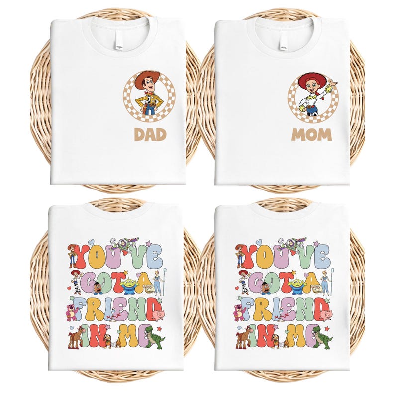May include: Four white t-shirts with colorful graphics. Two shirts have character portraits and the words "DAD" and "MOM." The other two shirts say "YOU'VE GOT A FRIEND IN ME" with cartoon characters.