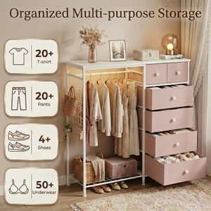 May include: A white and pink multi-purpose storage unit with drawers and a hanging rod for clothes. The unit includes drawers, shelves, and a hanging rod. The text on the image says "Organized Multi-purpose Storage", "20+ T-shirt", "20+ Pants", "4+ Shoes", and "50+ Underwear".