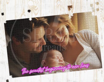 May include: A jigsaw puzzle featuring a family portrait of a couple and a baby. The puzzle has the text "The sweetest beginning to our lives" in pink. The puzzle is on a light wood grain surface.