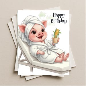 May include: A birthday card featuring a cartoon pig in a spa setting. The pig is wearing a white robe and towel, holding a drink with corn. The card reads "Happy Birthday" in black script. The card is on a stack of white envelopes.