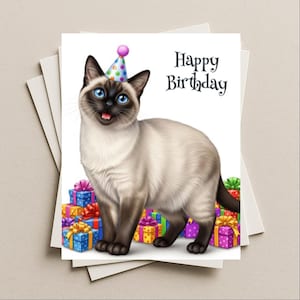 May include: A greeting card featuring a Siamese cat wearing a party hat and standing in front of wrapped gifts. The card has the words "Happy Birthday" in black script. The cat has blue eyes and a pink tongue.