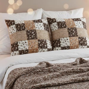 Neutral mocha floral patchwork pillow cover with gingham accents in warm shades of cream, beige, and brown. High-resolution detail focused on the cozy aesthetic design. Great for bedroom styling, living room pillows, autumn decor, and coffee-colored interiors. A must-have for hygge and cozy girl decor enthusiasts.