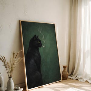 May include: A framed art print featuring a black cat with yellow eyes smoking a cigarette. The cat is set against a dark green background. The frame is a light wood color.