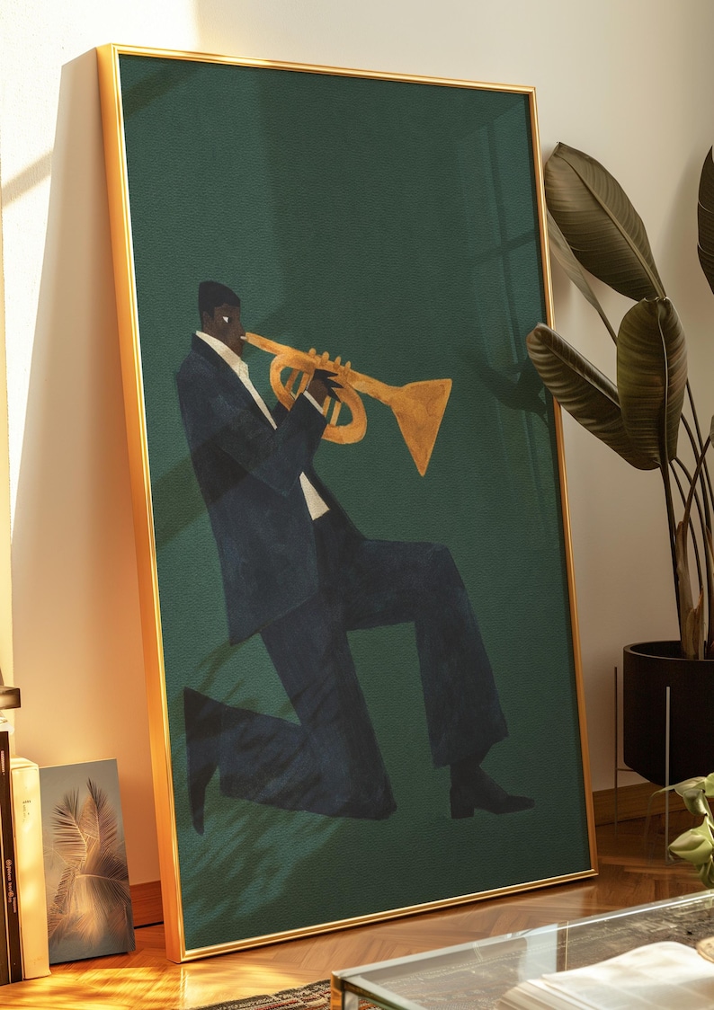 May include: A framed art print depicting a musician playing a gold trumpet. The figure is in a dark blue suit against a dark green backdrop. The frame is gold.