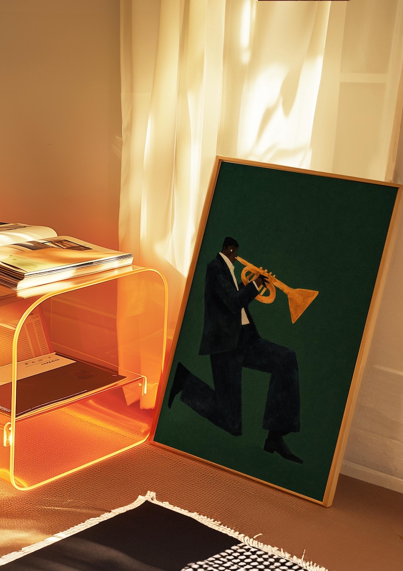 May include: A framed art print showing a musician playing a trumpet. The artwork features a figure in a dark suit against a deep green background. The trumpet is gold, and the frame is a light wood colour. The print is suitable for home decor.