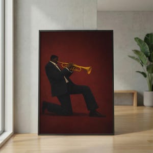 May include: A framed wall art print featuring a person in a dark suit kneeling while playing a bright yellow trumpet. The subject is positioned against a solid, deep red background, capturing a musical performance in a formal attire.