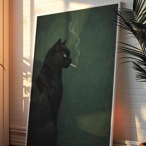 May include: Framed art print featuring a black cat with yellow eyes smoking a cigarette. The cat is set against a dark green background. The artwork is leaning against a white brick wall, with sunlight streaming in.