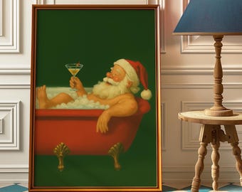 May include: Framed artwork depicts Santa Claus relaxing in a red bathtub filled with bubbles, holding a martini. He wears a Santa hat and has a long white beard. The background is a dark green, and the frame is gold.