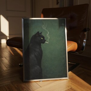 May include: A framed art print featuring a black cat with yellow eyes smoking a cigarette. The cat is set against a dark green background. The artwork is in a silver frame and is displayed indoors.