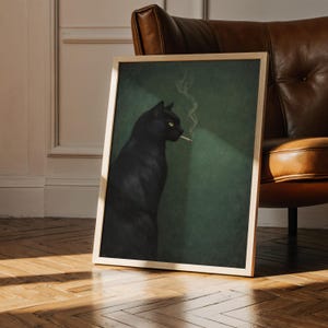 May include: A framed art print featuring a black cat with yellow eyes smoking a cigarette. The cat is set against a dark green background with a beam of light. The frame is a light wood color.