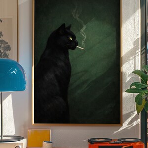 May include: A framed art print featuring a black cat with yellow eyes smoking a cigarette. The cat is set against a dark green background. The artwork is displayed in a room with a record player and other decor.