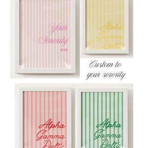 May include: Four framed prints with white borders. The prints feature vertical striped backgrounds in pink, yellow, red, and green. Each print has text in cursive, including "Your Sorority" and "Alpha Gamma Delta". The phrase "Custom to your sorority" is also displayed.