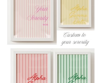 May include: Four framed prints with white borders. The prints feature vertical striped backgrounds in pink, yellow, red, and green. Each print has cursive text, including "Your Sorority" and "Alpha Gamma Delta". The phrase "Custom to your sorority" is also displayed.