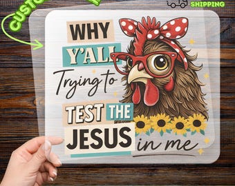 May include: A DTF transfer sheet featuring a brown chicken wearing red glasses and a red polka dot headscarf. Below the chicken are yellow sunflowers. The text reads: WHY Y'ALL Trying to TEST THE JESUS in me. The design is on a clear backing.