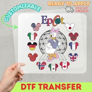 May include: DTF transfer featuring Daisy Duck in front of a geometric sphere, surrounded by Mickey Mouse head designs with flags. The word "Epcot" is above Daisy. Text includes "Customizable" and "Ready to Apply".