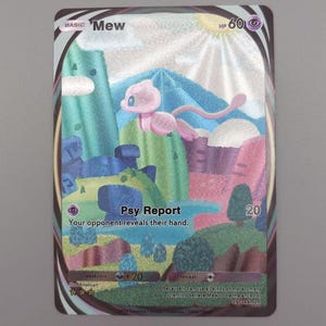 May include: A holographic Mew Pokémon trading card. The card features a pink Mew character in a colorful landscape with text that reads "Psy Report" and "Your opponent reveals their hand."