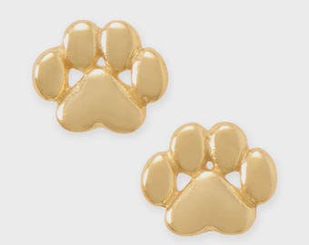 May include: Two gold-colored paw print stud earrings. Each earring features a detailed paw print design with five rounded pads. The earrings are presented on a light background, highlighting their shiny, metallic finish.